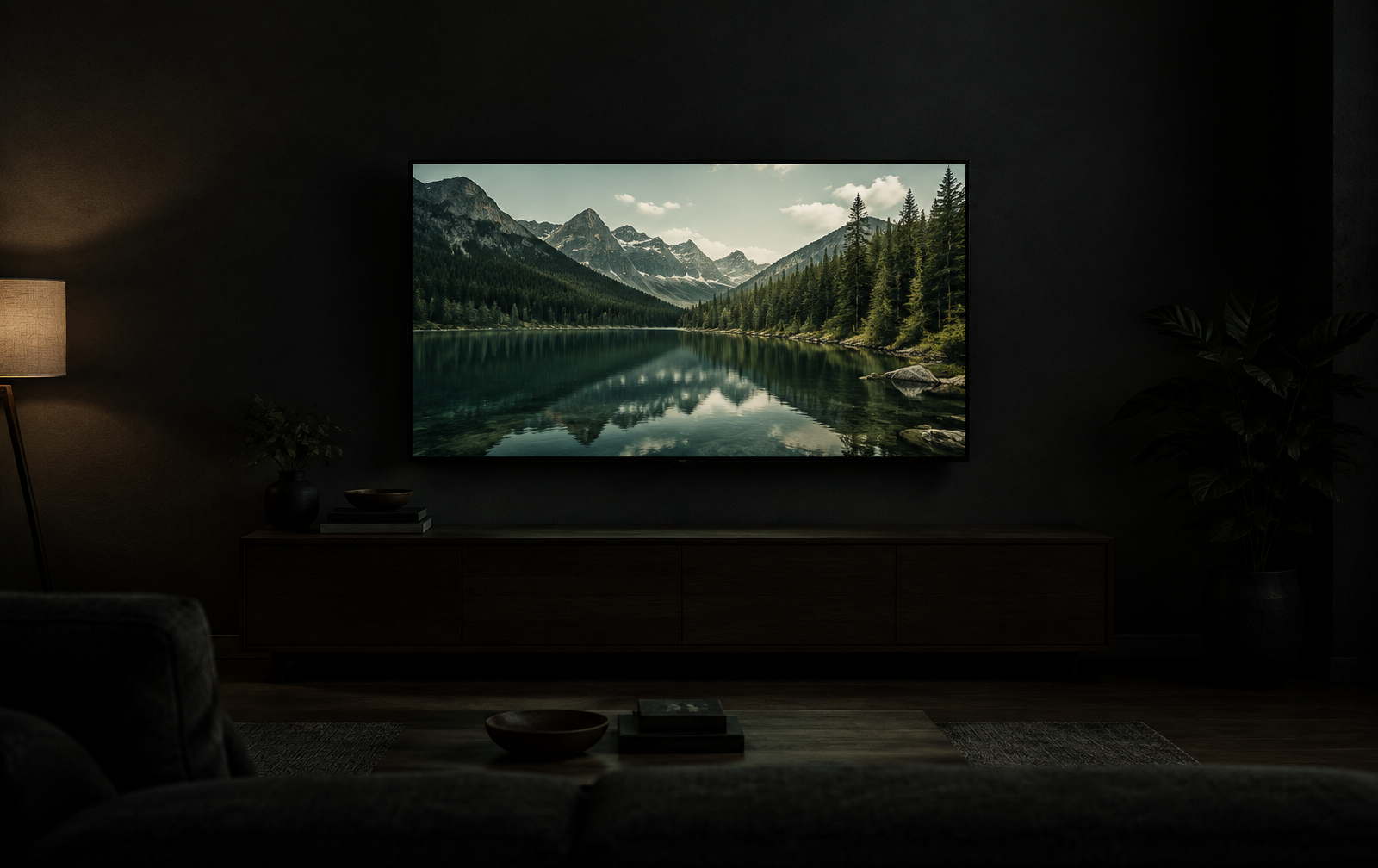 enthusiast tweaking view of the same mountain lake on a wall mounted display
